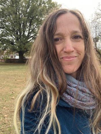 Female Veteran smiling.