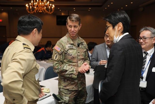 Col. Marcus Hunter, center, commander of U.S. Army Garrison Japan, greets Japanese partners before a downed aircraft exercise at Camp Zama, Japan, Jan. 28, 2025. More than 50 representatives from across the garrison, U.S. Army Japan, South Kanto...