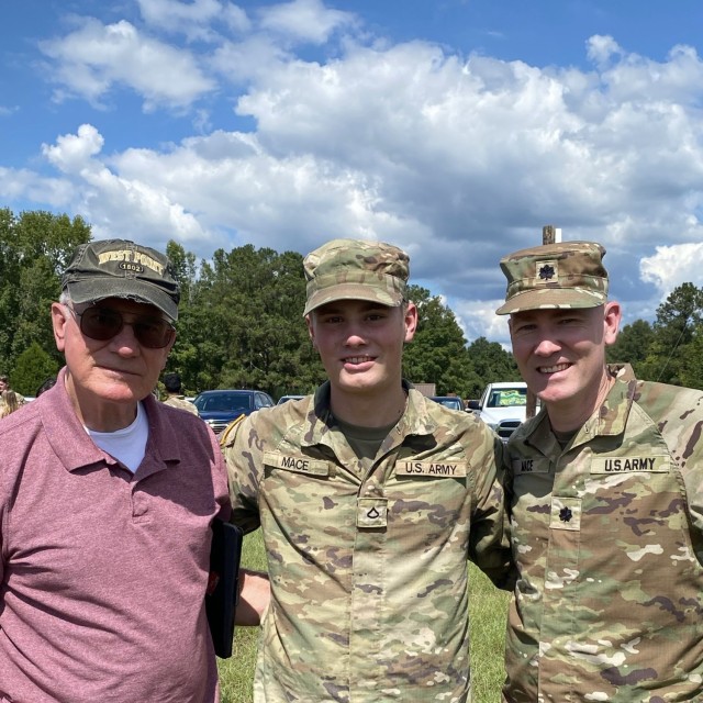 Three generations of the Mace family pose for a photo at Thor's basic training graduation in August 2024 at Fort Sill, OK.  From left to right is Lt. Cmdr. (ret.) Robert Mace, Pfc. Thor Mace and Lt. Col. Brandon Mace.
