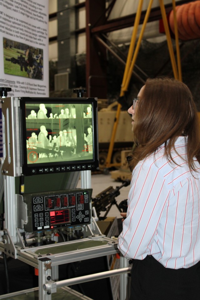 PICATINNY ARSENAL, N.J. - Julie Jochem, Legislative Director, explores target engagement while using the Common Remotely Operated Weapon Station (CROWS) sensor suite, which includes a daytime video camera, thermal camera and laser rangefinder,...