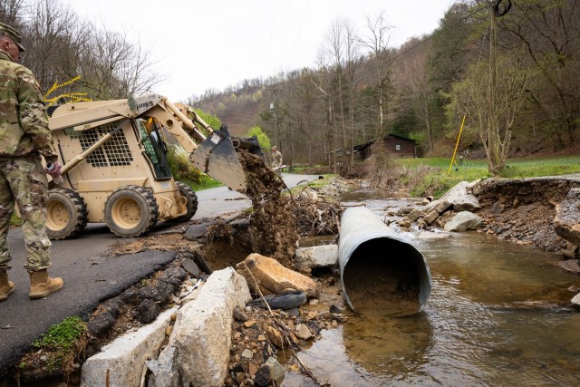 U.S. Army Sgt. Brian Mccall uses a skid steer to repair roadsides on a county road in Hindman, Ky. on April 1, 2025. Maccall and members of Detachment 1, 149th Vertical Construction Company, 149th Maneuver Enhancement Brigade have been working for...