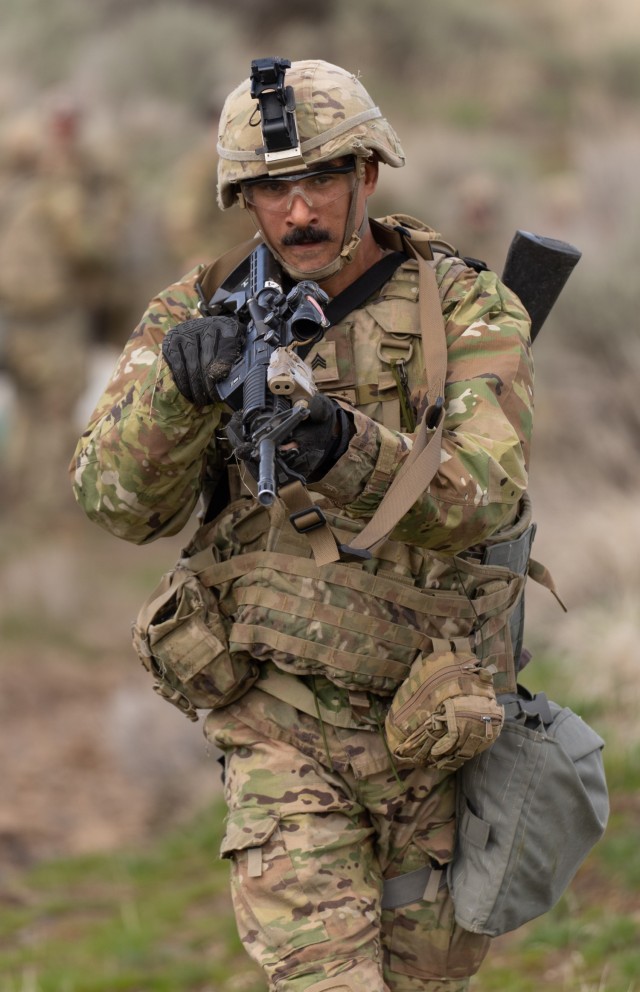Sgt. Steven Massey, 2nd Battalion, 162nd Infantry Regiment, assaults toward the objective during a dry-fire iteration of the platoon urban assault lane at Range 25, Yakima Training Center, Wash., April 1, 2025. Platoon movement tactics training...