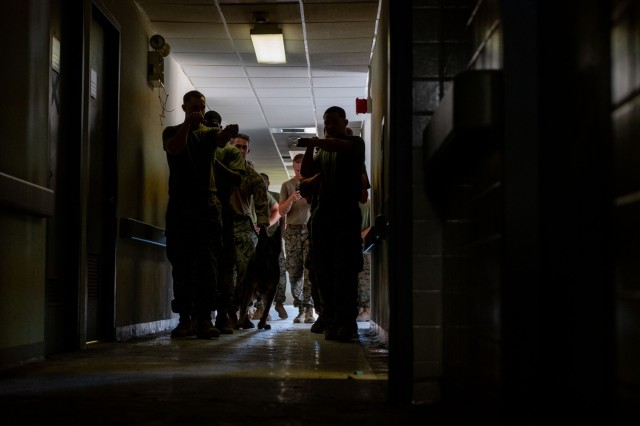 U.S. Marines integrate a military working dog into their procedures for clearing rooms at Naval Station Guantanamo Bay, Cuba, April 4, 2025. The training enhanced unit effectiveness by demonstrating how military working dogs can detect threats and...