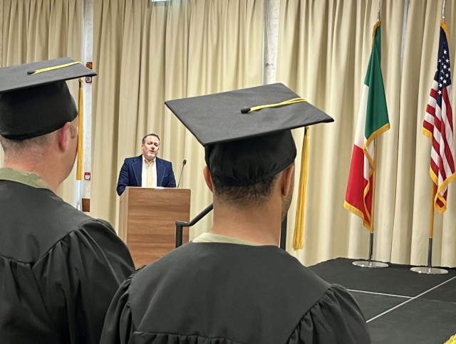 Jeremy Cates, a community member known for his performances in Soldiers Theatre productions, sang both the Italian and American anthems.