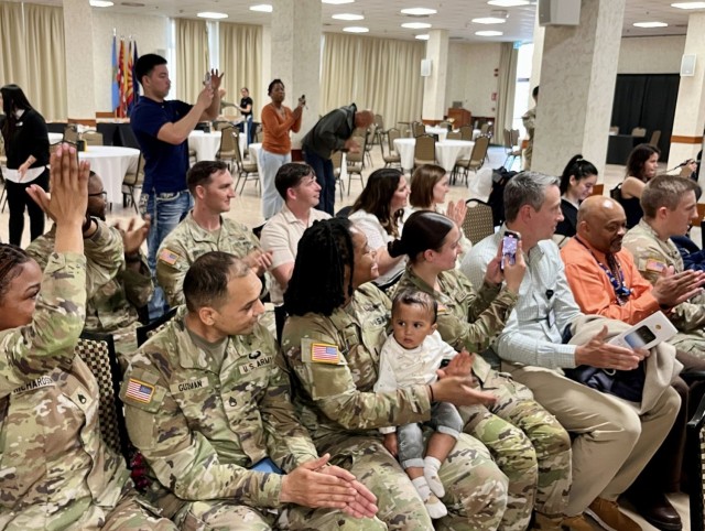 Family members and friends celebrate the graduation of their loves ones at U.S. Army Garrison Italy's graduation ceremony