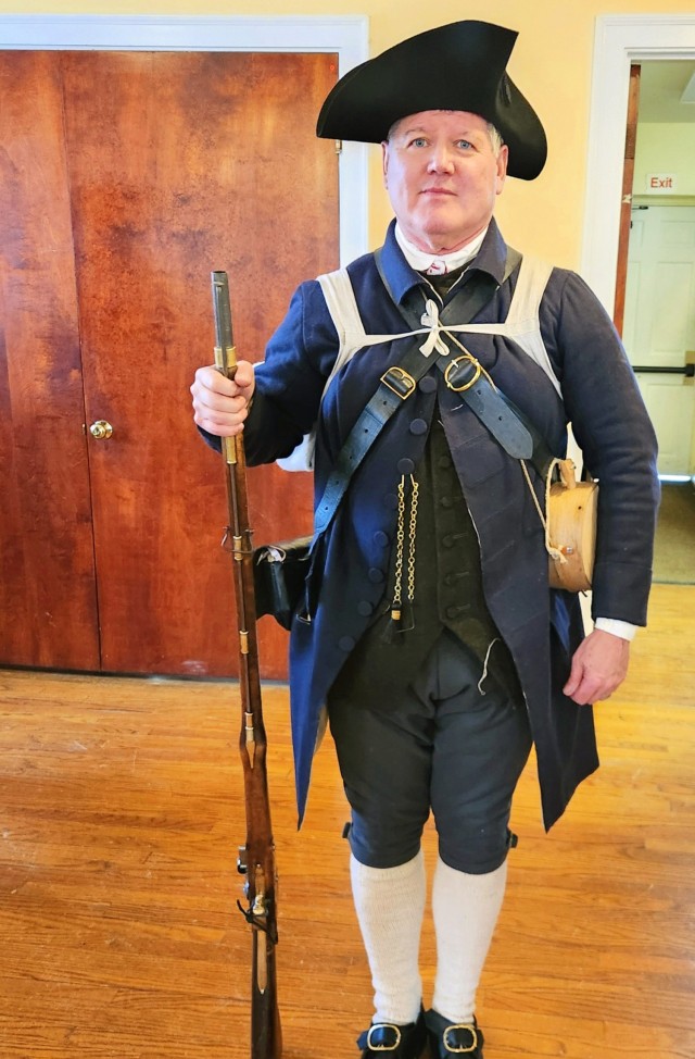 Steve Delity, a 1985 United States Military Academy graduate, poses for a photo with his Lexington Minute Men militia kit before drill practice for Lexington250 March 13, 2025 (Photo by Joe Farrar).