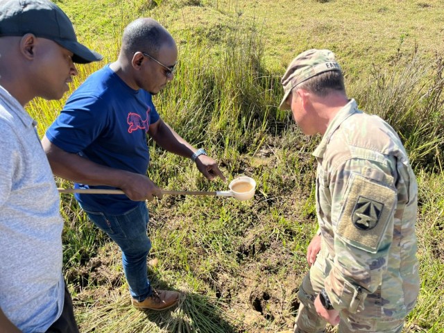 Maj. Eads and his team identify larvae of the Anopheles mosquito, the vector for malaria parasites, near the Justified Accord cantonment area.