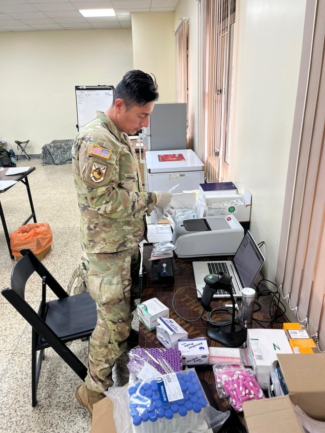 Maj. Luis Pow Sang, Military Chief of Microbiology, performs initial validation and testing of BioFire film array for use in real-time exercise support.