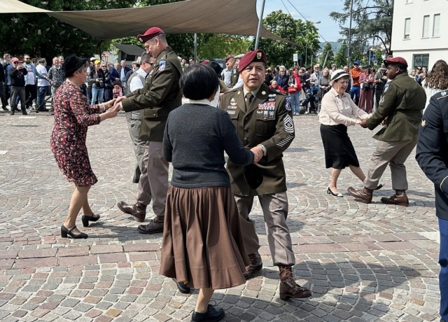 Lt. Col. Ryan Hulse and Command Sgt. Maj. Gerardo Moran dance with local Italians during the April 27, 2025, event in Montecchio Maggiore. The 173rd BSB has a longstanding partnership with Montecchio Maggiore under U.S. Army Garrison Italy’s...