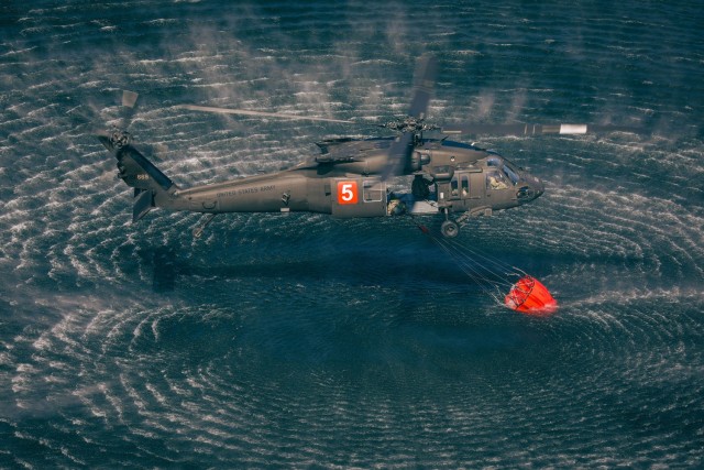 Minnesota National Guard Aviators from the 34th Combat Aviation Brigade conduct their annual Operation Burn Out with the Minnesota Department of Natural Recourses with UH-60 Blackhawk helicopters and CH-47 Chinook Helicopters at Camp Ripley...