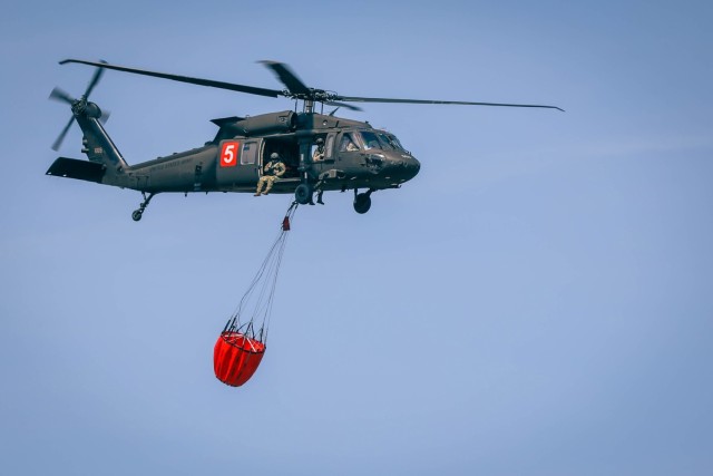 Minnesota National Guard Aviators from the 34th Combat Aviation Brigade conduct their annual Operation Burn Out with the Minnesota Department of Natural Recourses with UH-60 Blackhawk helicopters and CH-47 Chinook Helicopters at Camp Ripley...