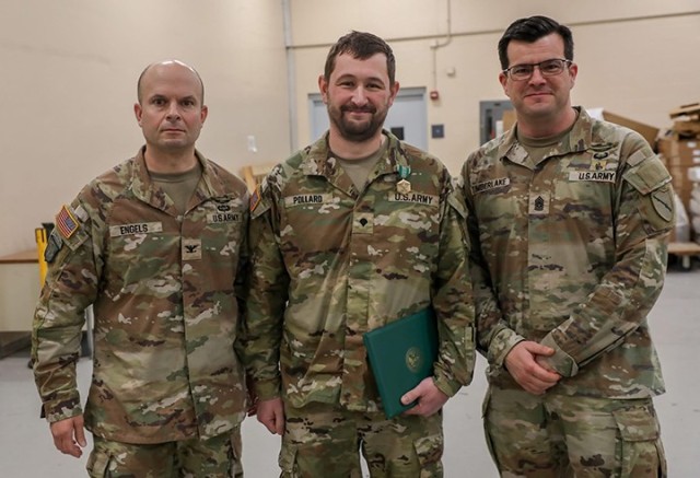 Col. Steven Engels and Command Sgt. Maj. Benzie Timberlake, 75th Troop Command, with Spc. Brandon Pollard, following his heroic actions following an accident in Shelby County, March 15, 2025. Pollard helped a driver from her overturned vehicle...