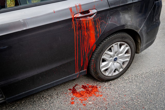 Fake blood is splattered across a vehicle door as part of a simulated crash scene during an emergency services exercise in Powidz, Poland, May 15, 2024. The use of moulage and graphic effects created a realistic training environment to help Polish...