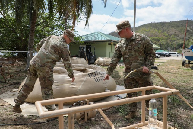 Sgt. Hanna Sturgeon, left, and Spc. Colton Hines, a water purification specialist with the 935th Aviation Support Battalion, Missouri Army National Guard, prepares to test the water during the TRADEWINDS 25 (TW25) exercise at Teteron Bay, Trinidad...