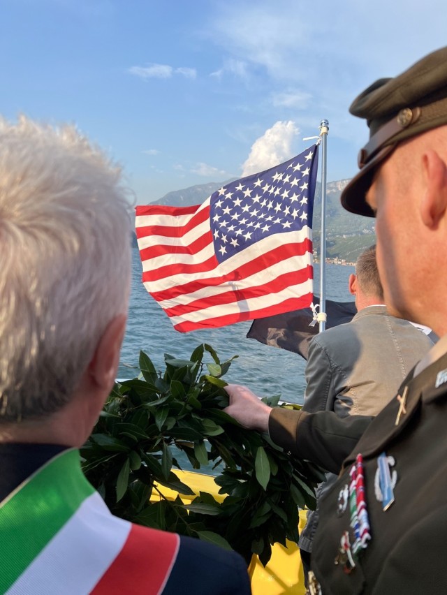 The Mayor of Nago Torbole, Gianni Morandi and Col. Scott Horrigan, commander of U.S. Army Garrison Italy, prepare to present a wreath on Lake Garda, directly above where  a DUKW amphibious vehicle sank during WWII