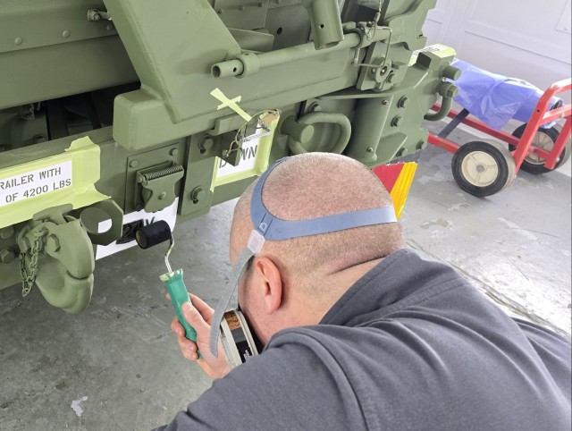 LRC Benelux autobody tech transforms APS-2 gear from tan to green on Army’s 250th