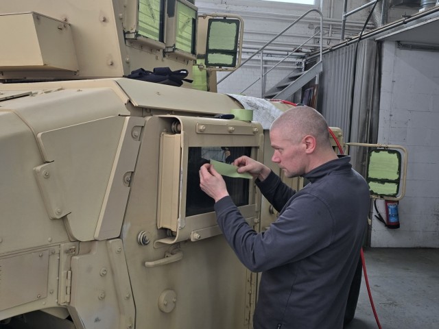 LRC Benelux autobody tech transforms APS-2 gear from tan to green on Army’s 250th