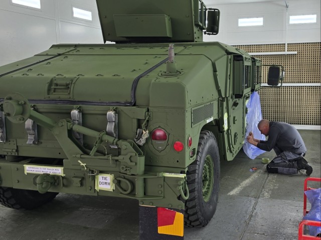 LRC Benelux autobody tech transforms APS-2 gear from tan to green on Army’s 250th