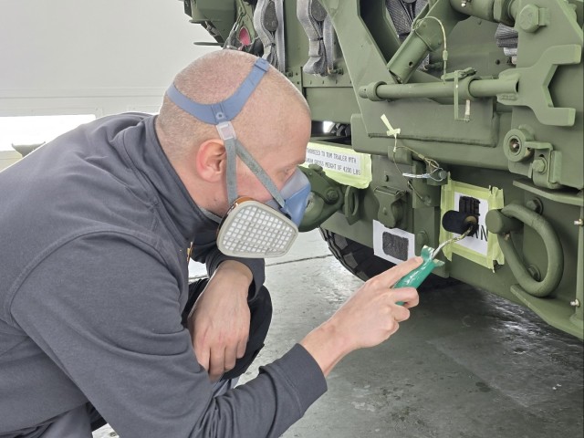 LRC Benelux autobody tech transforms APS-2 gear from tan to green on Army’s 250th
