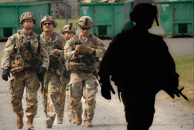 Iowa Army National Guard Soldiers walk to dining facility at JRTC