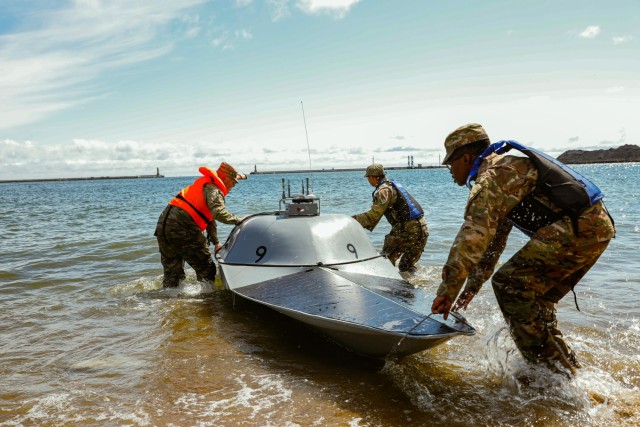U.S. Army Soldiers assigned to the Multi-Domain Effects Battalion, 2nd Multi-Domain Task Force, retrieve an Unmanned Surface Vessel (USVs) from the water during Arcane Thunder 25, 16 May, 2025. Exercise Arcane Thunder 25 is a collaborative U.S....