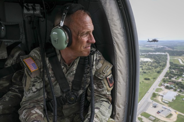Army Command Sgt. Maj. John Raines, senior enlisted advisor to the chief of the National Guard Bureau, looks over an area impacted by flash floods in Kerrville, Texas, July 4, 2025. To date, National Guard search-and-rescue operations, led by the...