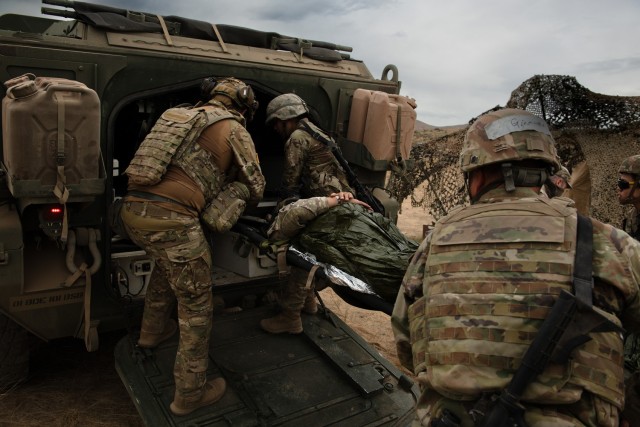 U.S. Soldiers with Charlie Company, 181st Brigade Support Battalion, 81st Stryker Brigade Combat Team, Washington National Guard, transport a patient during mass casualty training at Yakima Training Center, Wash., July 20, 2025. Mass casualty...