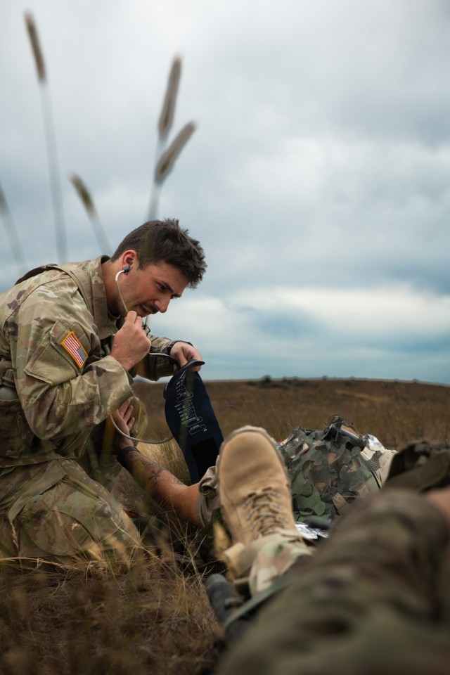 U.S. Army Pfc. Eric Harden with Charlie Company, 181st Brigade Support Battalion, 81st Stryker Brigade Combat Team, Washington National Guard, triages a patient during mass casualty training at Yakima Training Center, Wash., July 20, 2025. Mass...