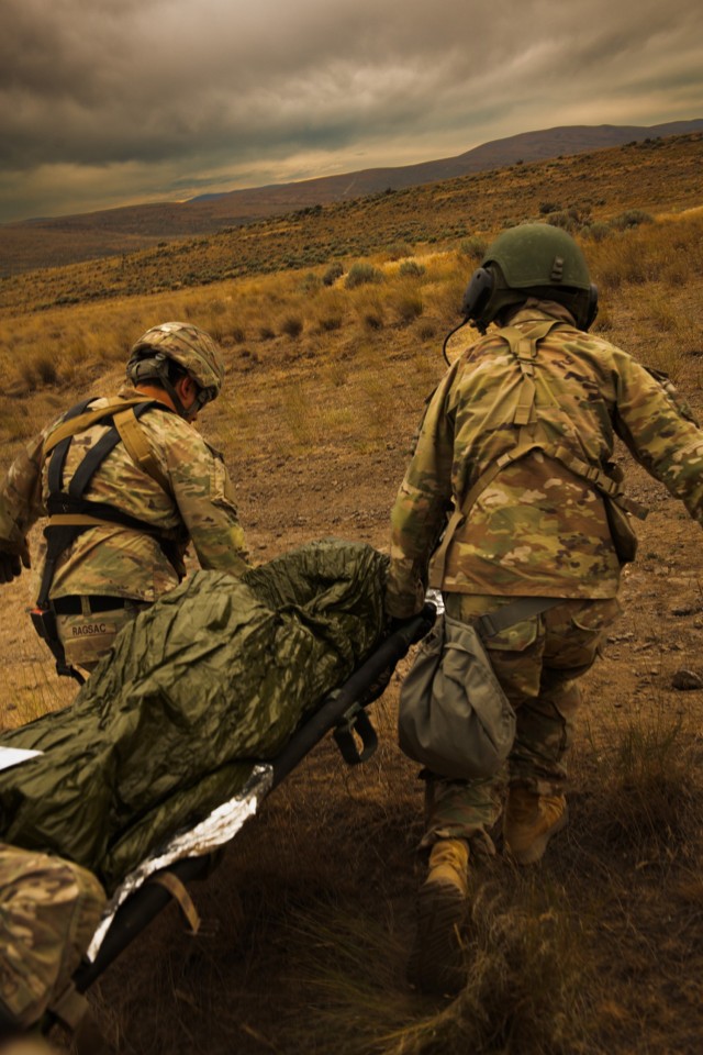 U.S. Soldiers with Charlie Company, 181st Brigade Support Battalion, 81st Stryker Brigade Combat Team, Washington National Guard, triage a patient during mass casualty training at Yakima Training Center, Wash., July 20, 2025. Mass casualty...