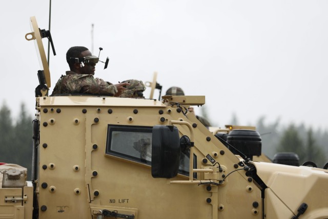 A U.S. Army Soldier assigned to the Deathwatch Platoon, 10th Brigade Engineer Battalion, 1st Armored Brigade Combat Team, 3rd Infantry Division, operates a first person view drone on a Joint Light Tactical Vehicle (JLTV) during individual...