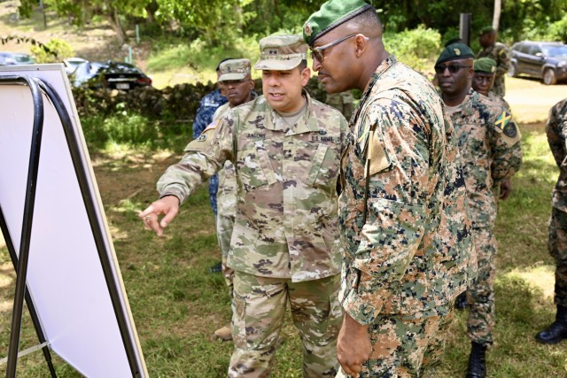 Maj. Gen. John Andonie, Commanding General (Interim) for the D.C. National Guard, learns about upcoming training activities at Moneague Training Camp during a senior leader visit to Jamaica, on July 18, 2025. The D.C. National Guard's...
