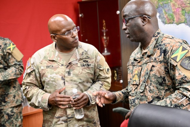 Command Sgt. Maj. Ronald L. Smith Jr., Command Senior Enlisted Leader (CSEL) for the D.C. National Guard, speaks with Brig. Ricardo Blidgen, Commander of the Jamaica National Reserve, during his to visit to the Caribbean Regional Training Camp in...