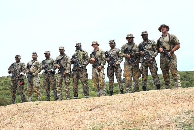 Soldiers from the D.C. National Guard, Barbados Defence Force Reserves, Jamaica Defence Force, and Jamaica National Reserve stand for a photograph at Twickenham Park Range in St. Catherine, Jamaica, on July 17, 2025. As part of the Caribbean...