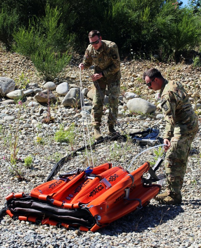 Sgt. 1st Class Chris Suveges and Sgt. Tyler Johnston, Charlie Company, 1st Battalion, 140th Aviation, 96th Troop Command, Washington Army National Guard lay out the water bucket prior to training with Central Pierce Fire and Rescue, June 30, 2025,...