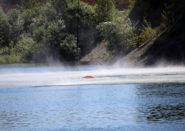A UH-60 Blackhawk Helicopter from Charlie Company, 1st Battalion, 140th Aviation, 96th Troop Command, Washington Army National Guard conducts water bucket training with Central Pierce Fire and Rescue, June 30, 2025, near Puyallup, Wash.