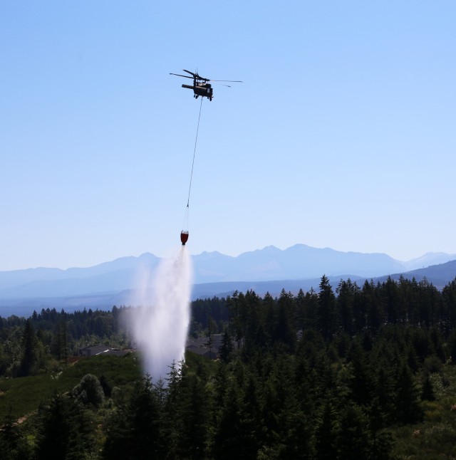 A UH-60 Blackhawk Helicopter from Charlie Company, 1st Battalion, 140th Aviation, 96th Troop Command, Washington Army National Guard conducts water bucket training with Central Pierce Fire and Rescue, June 30, 2025, near Puyallup, Wash. (U.S....