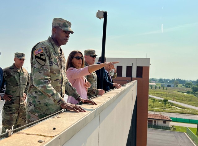 Sonia Paoloni, Director of the USAG Italy S-5, explains planned improvements at Caserma Del Din to Maj. Gen. James Smith, acting commander of U.S. Army Installation Management Command, during his Aug. 1 visit to Vicenza.