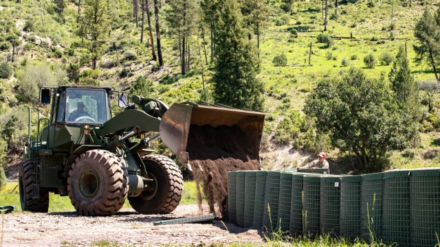 U.S. National Guard Soldier helps rescue 8 people from a flooded home.